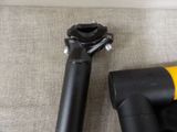 a black and yellow vacuum and a black and yellow hose