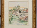 une image représentant une photo d'un tableau représentant une ville, dans un cadre doré