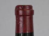 a close up of a bottle of wine on a table