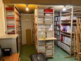 a room that has a lot of shelves and boxes on it