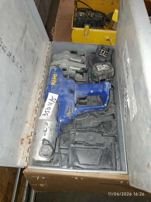 a box with tools inside of it on the floor