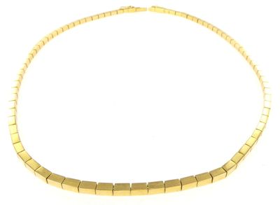 a close up of a gold necklace on a white background