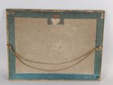 an old wooden picture frame with a rope hanging from it ' s side