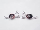 a pair of black and white earrings with diamonds on them