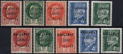 a group of stamps with different colors on them on a black surface