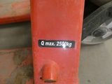 a close up of a red skateboard with a sticker that says q max 250kg