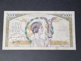 a picture of a bank note with a woman holding a bird