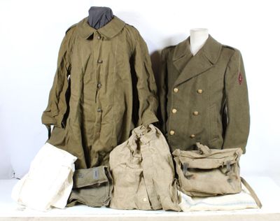two coats and a bag sitting on a table