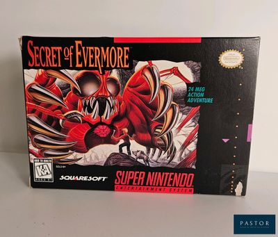 La boîte du jeu « Secret of Evermore » est posée sur une table.