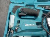 a blue tool box with tools in it on the floor
