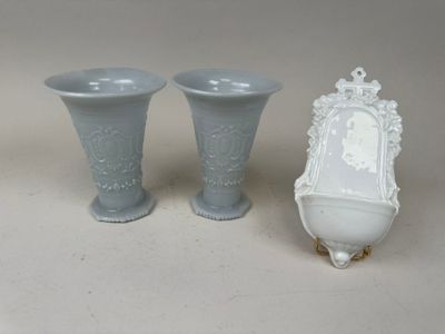 two vases sitting next to each other on a table