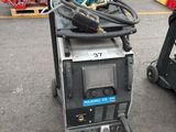 two machines that are sitting in the parking lot