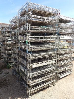 a large pile of cages stacked on top of each other