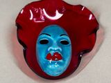 a red and blue mask with a blue face