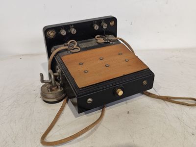 an old fashioned telephone that is sitting on a table