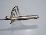 a metal object that looks like a sword on a stick