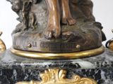 a statue of a woman sitting on top of a marble base