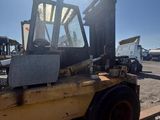 a forklift that is sitting in the dirt