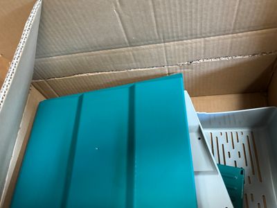 a box that has a blue tray inside of it