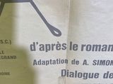a newspaper with a picture of a man holding a pair of scissors