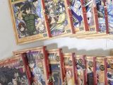 a lot of anime cards that are on a shelf