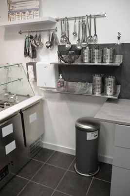 an image of a commercial kitchen with stainless steel appliances