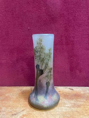 a vase that has a picture of a man and a woman on it