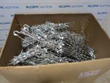 a cardboard box filled with lots of wire and scissors