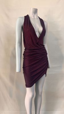 the mannequin is wearing a burgundy dress with a deep v neckline