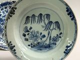 a blue and white plate with a blue and white design on it