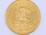 gold coin with the image of a man riding a horse on it