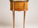 a small wooden table with a drawer on top of it