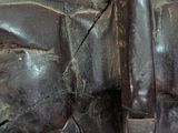 a close up of a bronze statue of a hand