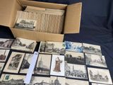 an old photo of a box of old postcards and a box of old postcards