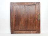 an old wooden door with a metal latch on it