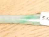 une photo d'une brosse à dents verte avec une étiquette dessus
