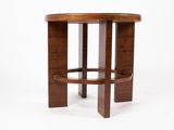 a close up of a wooden table with a round table top