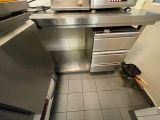 a kitchen with a stove, oven, and cabinets in it