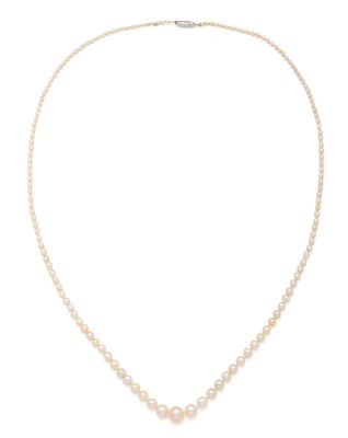 a white pearl necklace with a gold clasp
