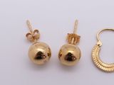 two pairs of gold earrings and a gold hoop
