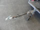 a small boat trailer with a tow bar attached to it