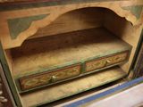 a wooden cabinet with two drawers in it