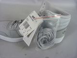 a pair of shoes with a price tag on them