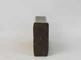 concrete block on a white surface with a white background