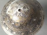 a close up of a metal object on a table