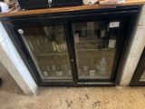 a refrigerator that has a bunch of bottles inside of it