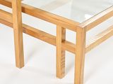 two tables with glass tops on a white surface