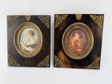 two framed pictures of a woman and a child in a gold frame