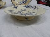 a blue and white bowl and a plate on a table