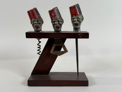three masks that are on a stand on a white background
